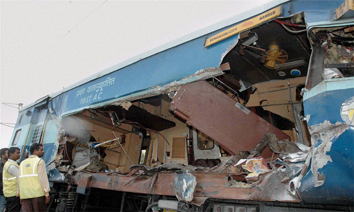 A granite boulder carried by the truck crashes into the first class coach  of the Nanded Express near Madakasira railway gate  in Anantapur district